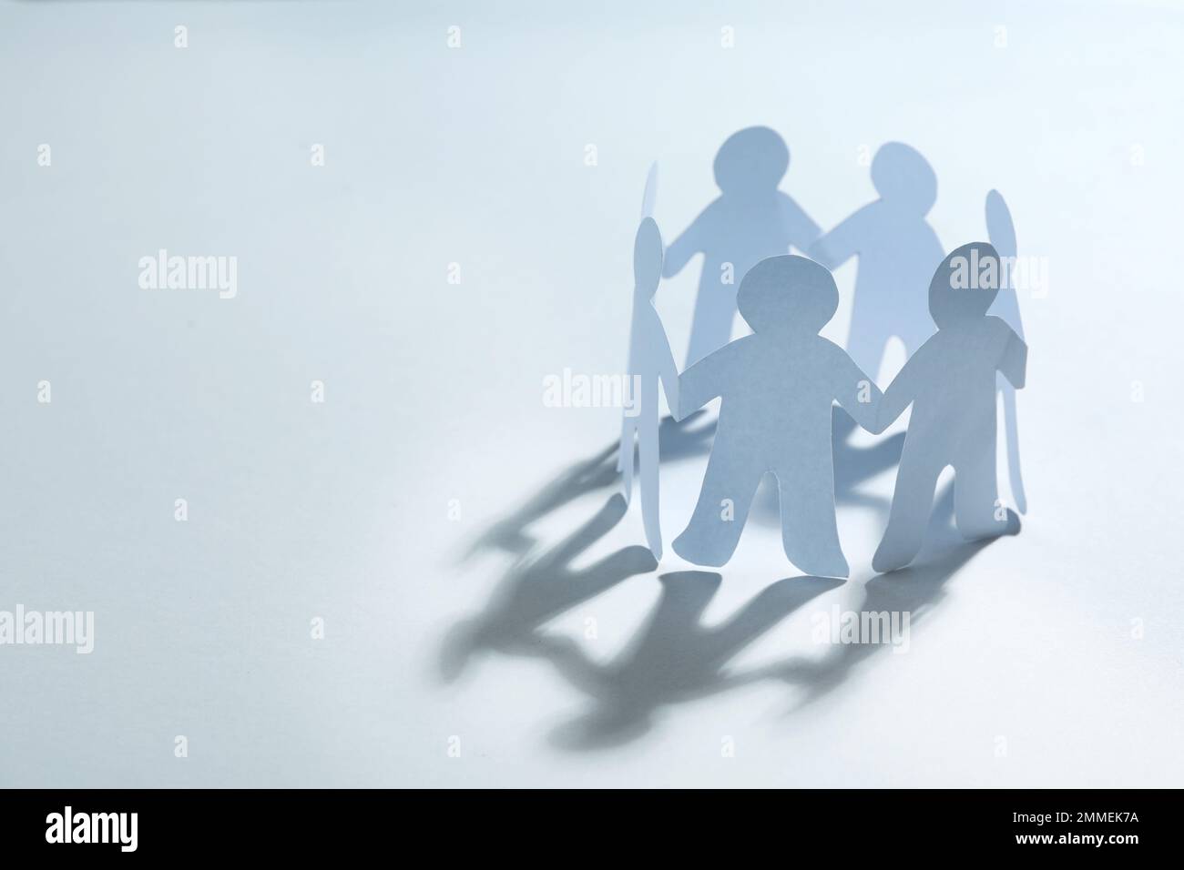 Paper people chain making circle on white background, space for text ...