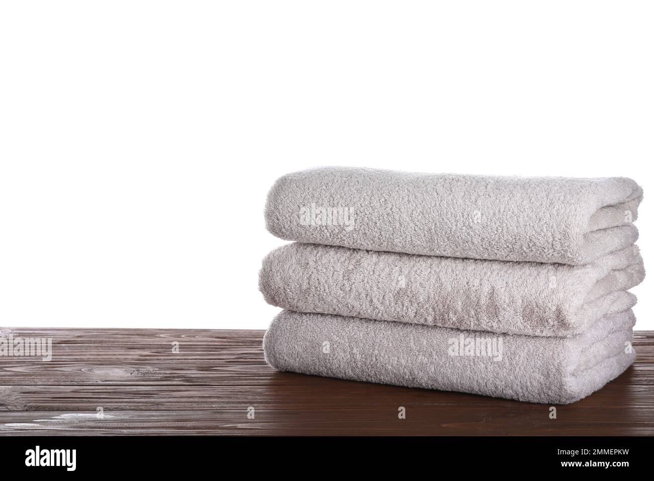 Stack of clean towels on white table in laundry room, space for text Stock  Photo - Alamy