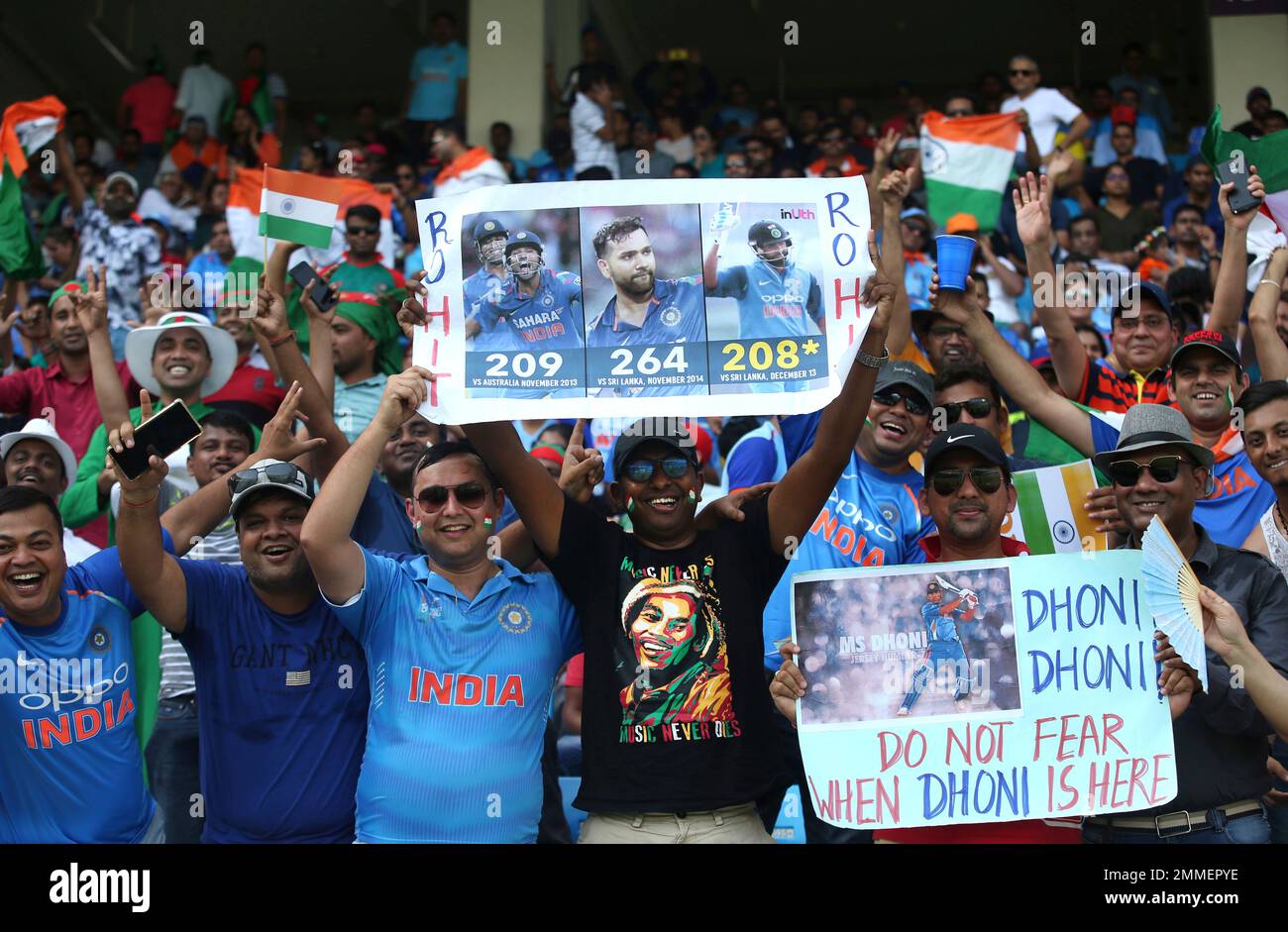 Indian supporters some of them holding placards cheer for their team before  the start of the final one day international cricket match of Asia Cup  between India and Bangladesh in Dubai, United