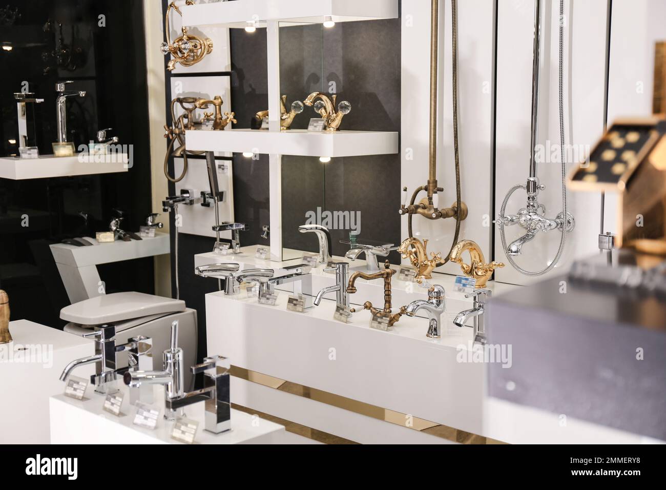 New shiny faucets in bathroom fixtures store. Total wholesale Stock