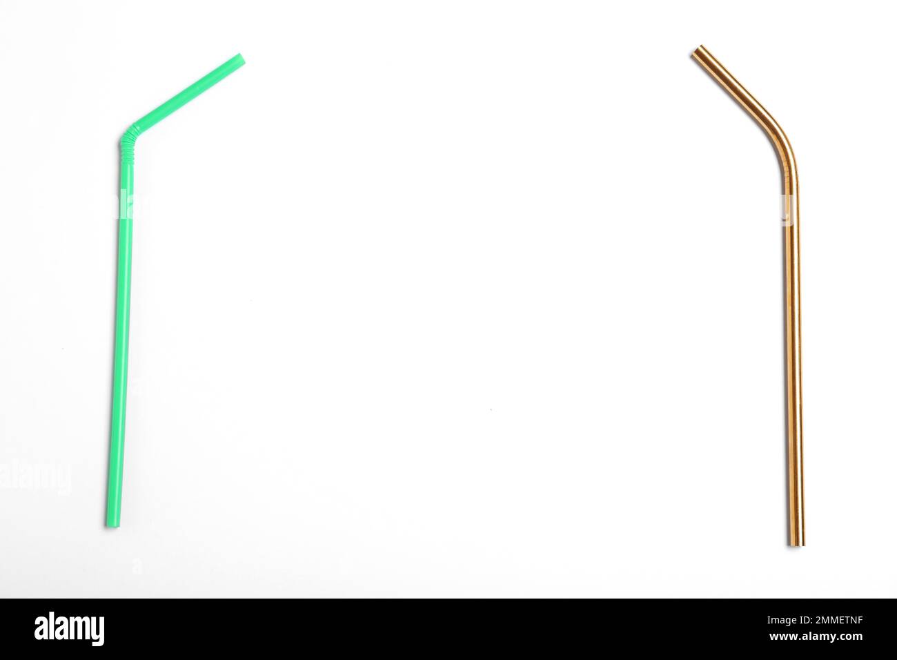 Plastic and metal drinking straws on white background, top view