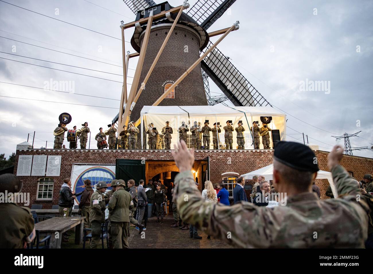 U.S. Army musicians from the 101st Airborne Division (Air Assault) Band, play on top of the historical Sint-Anthony Mill after the official ceremony of the 78th year commemoration of Operation Market Garden at Eerde, Netherlands, Sept. 17, 2022. As the Soldiers of the 101st Airborne Division (Air Assault) commemorate Market Garden 78, the 101st will continue to remain committed to collective defense and cooperative security alongside European allies and partners. Stock Photo