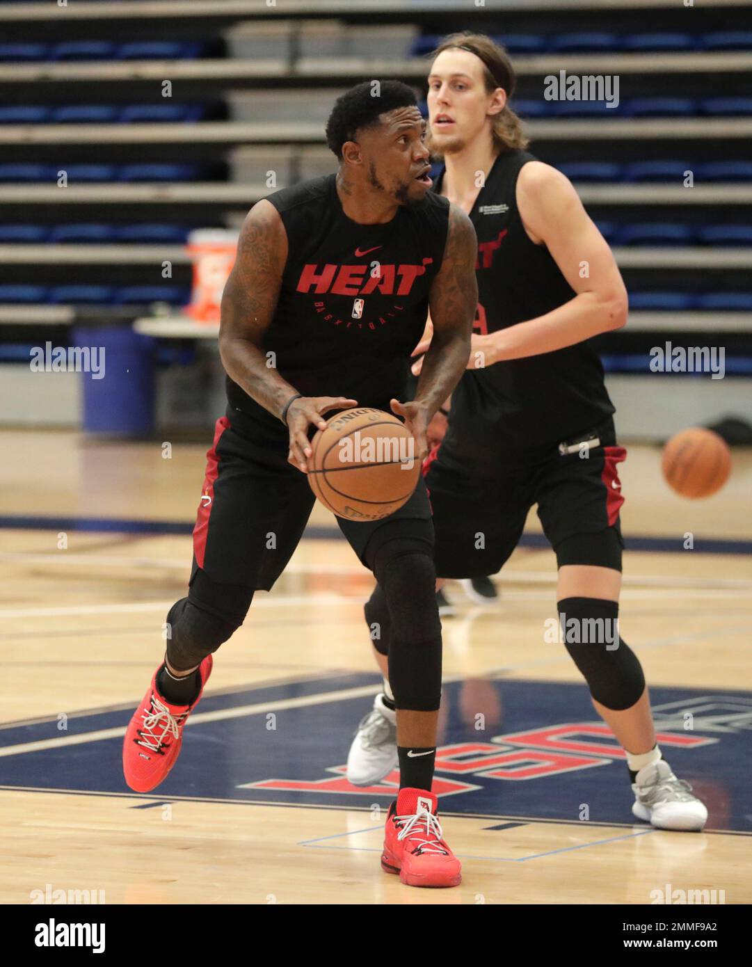 Miami Heat forward Udonis Haslem and forward Kelly Olynyk do drills