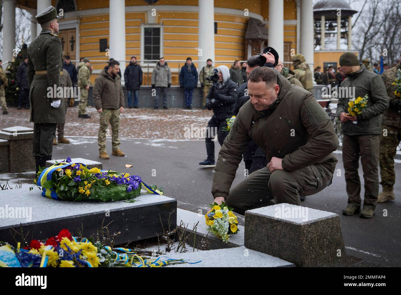 Kyiv, Ukraine. 29th Jan, 2023. Ukrainian chief of presidential staff Andrii Yermak places flowers at the memorial cross to the Heroes of Kruty to commemorate Kruty Heroes Remembrance Day at the Askold's Grave memorial site, January 29, 2023 in Kyiv, Ukraine. The memorial is in remembrance of the heroes of the Ukrainian Revolution of 1917-1921. Credit: Ukraine Presidency/Ukrainian Presidential Press Office/Alamy Live News Stock Photo