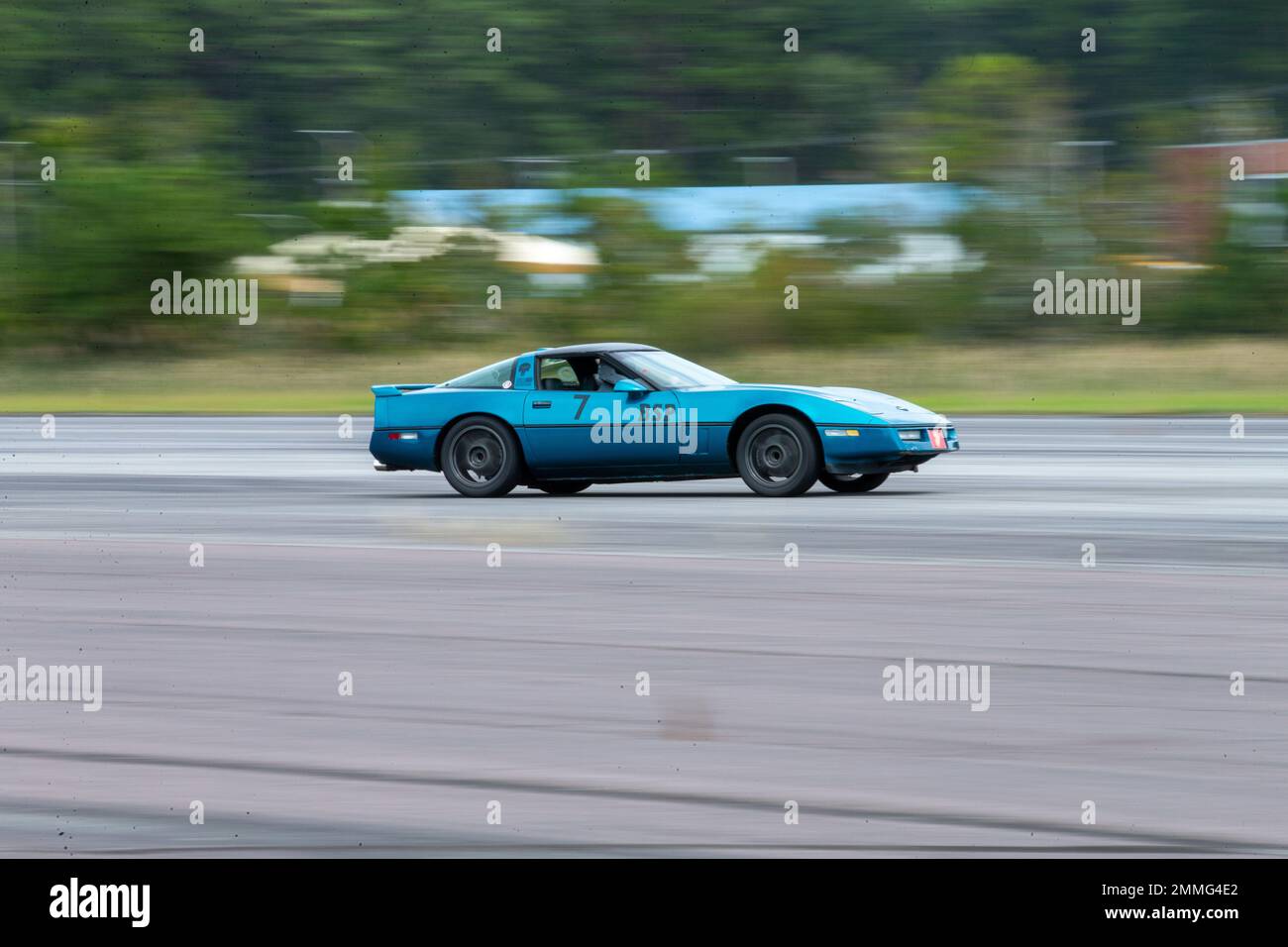 A participant races his 1987 Chevrolet Corvette down the Autocross course at Marine Corps Air Station Cherry Point, North Carolina, Sep. 17, 2022. The Sports Car Club of America and the Single Marine Program hosted Autocross, a car-controlled event where participants race for the fastest time in their given vehicle class. Stock Photo