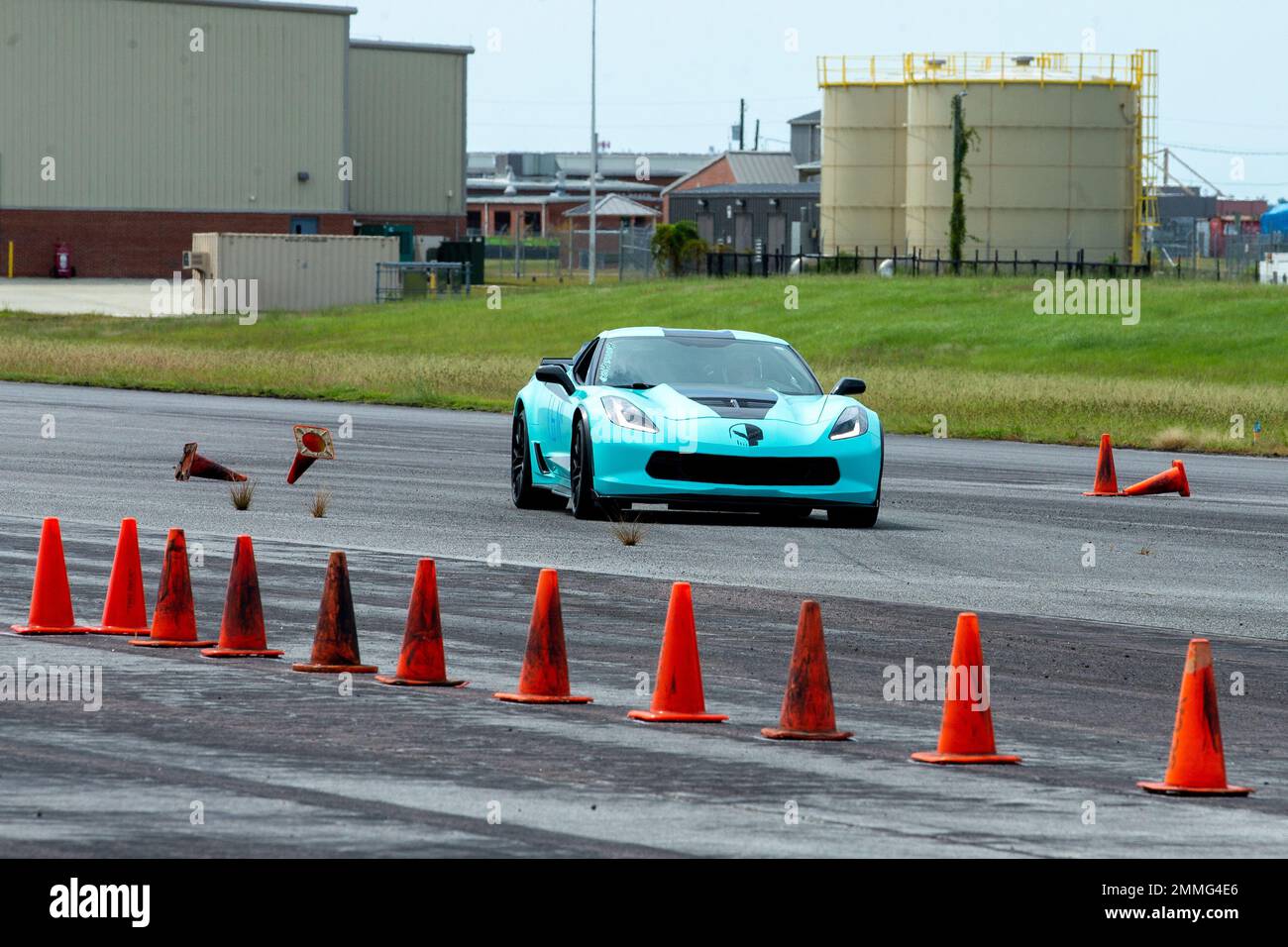 A participant hits a cone while racing their Chevrolet Corvette at Marine Corps Air Station Cherry Point, North Carolina, Sep. 17, 2022. The Sports Car Club of America and the Single Marine Program hosted Autocross, a car-controlled event where participants race for the fastest time in their given vehicle class. Stock Photo