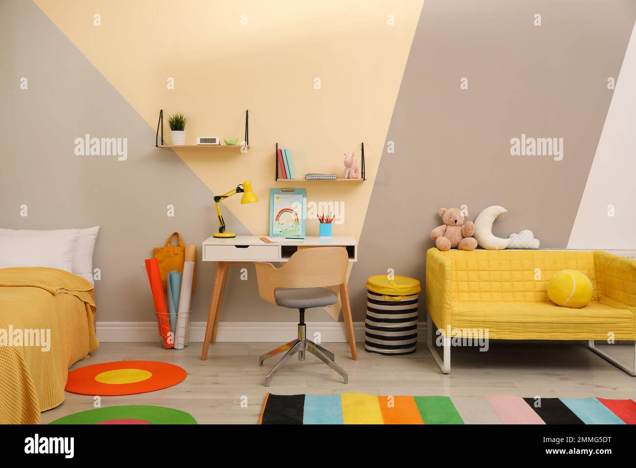 Stylish child room interior with comfortable bed and desk Stock Photo ...
