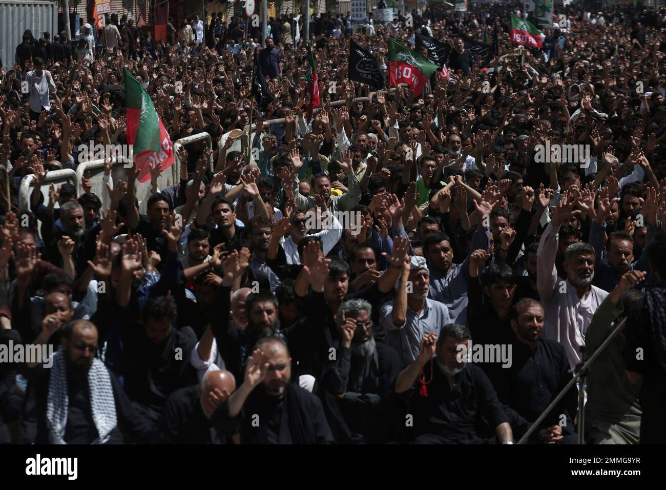 Shiite Muslims attend a procession to mark Ashoura in Karachi, Pakistan ...