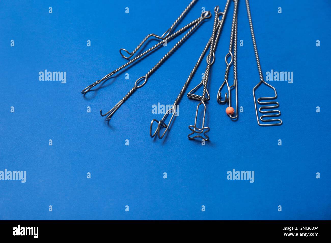 Set of logopedic probes for speech therapy on blue background. Space for text Stock Photo