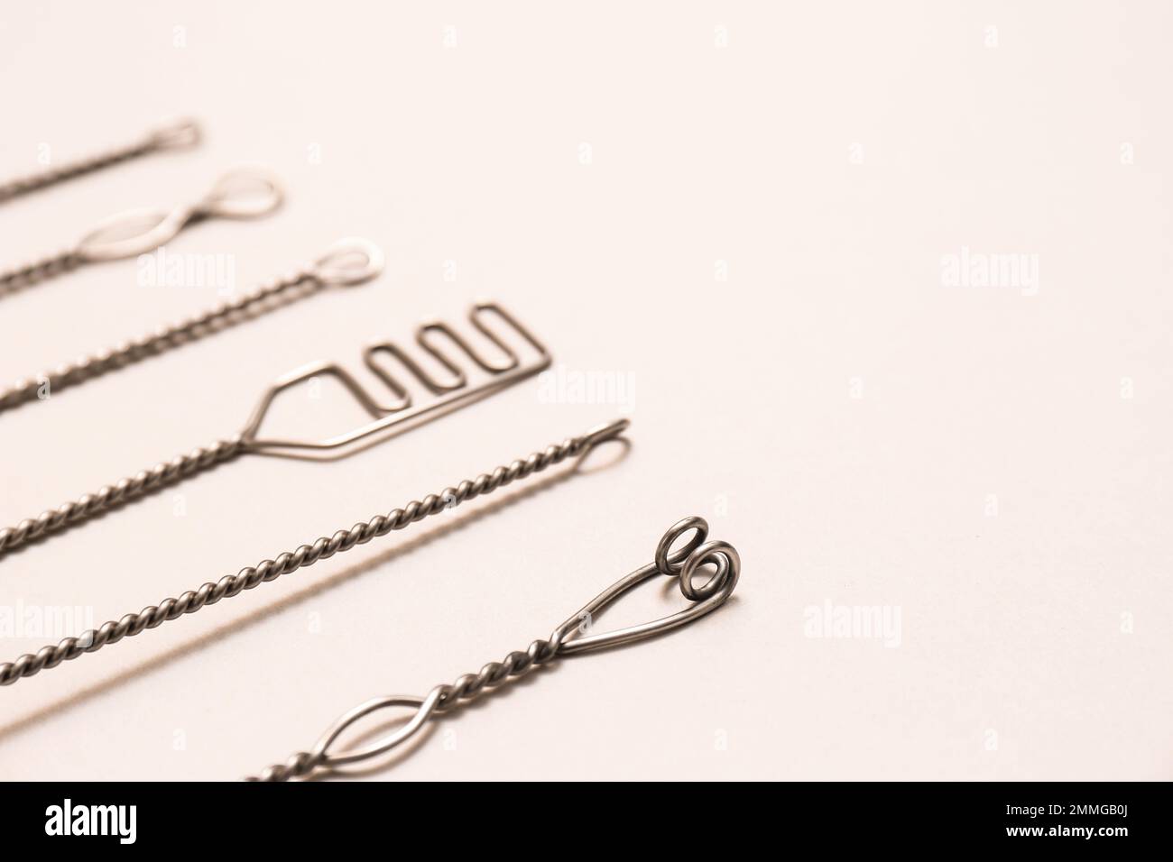Set of logopedic probes for speech therapy on beige background. Space for text Stock Photo