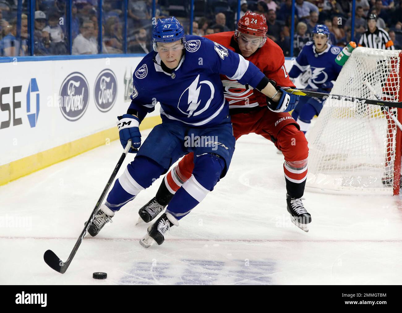 Tampa Bay Lightning forward Jonne Tammela (47) keeps the puck away from