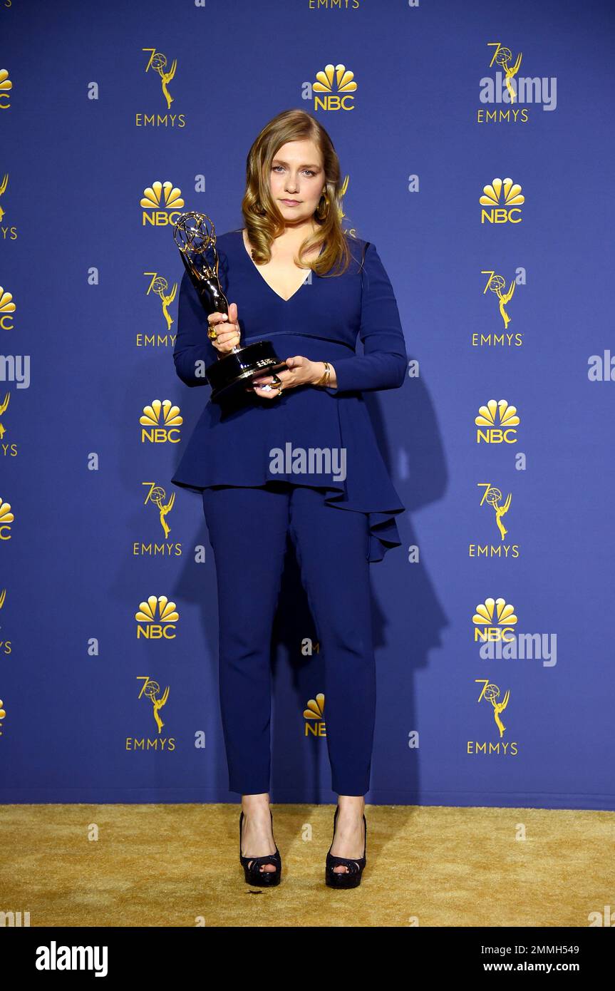 Merritt Wever poses in the press room with the award for outstanding