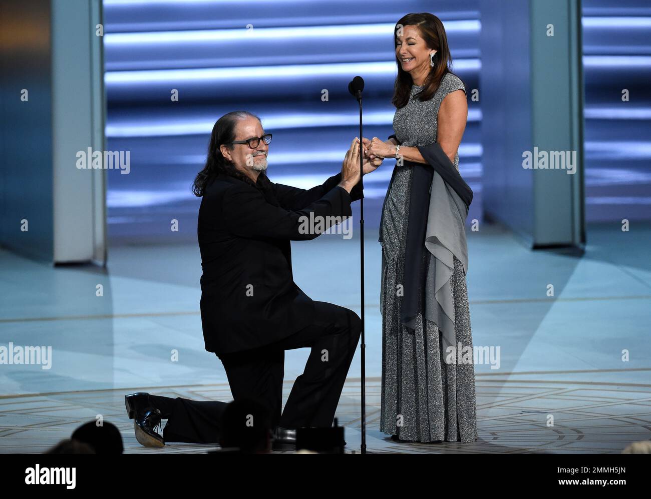 Glenn Weiss , left, proposes to Jan Svendsen at the 70th Primetime Emmy