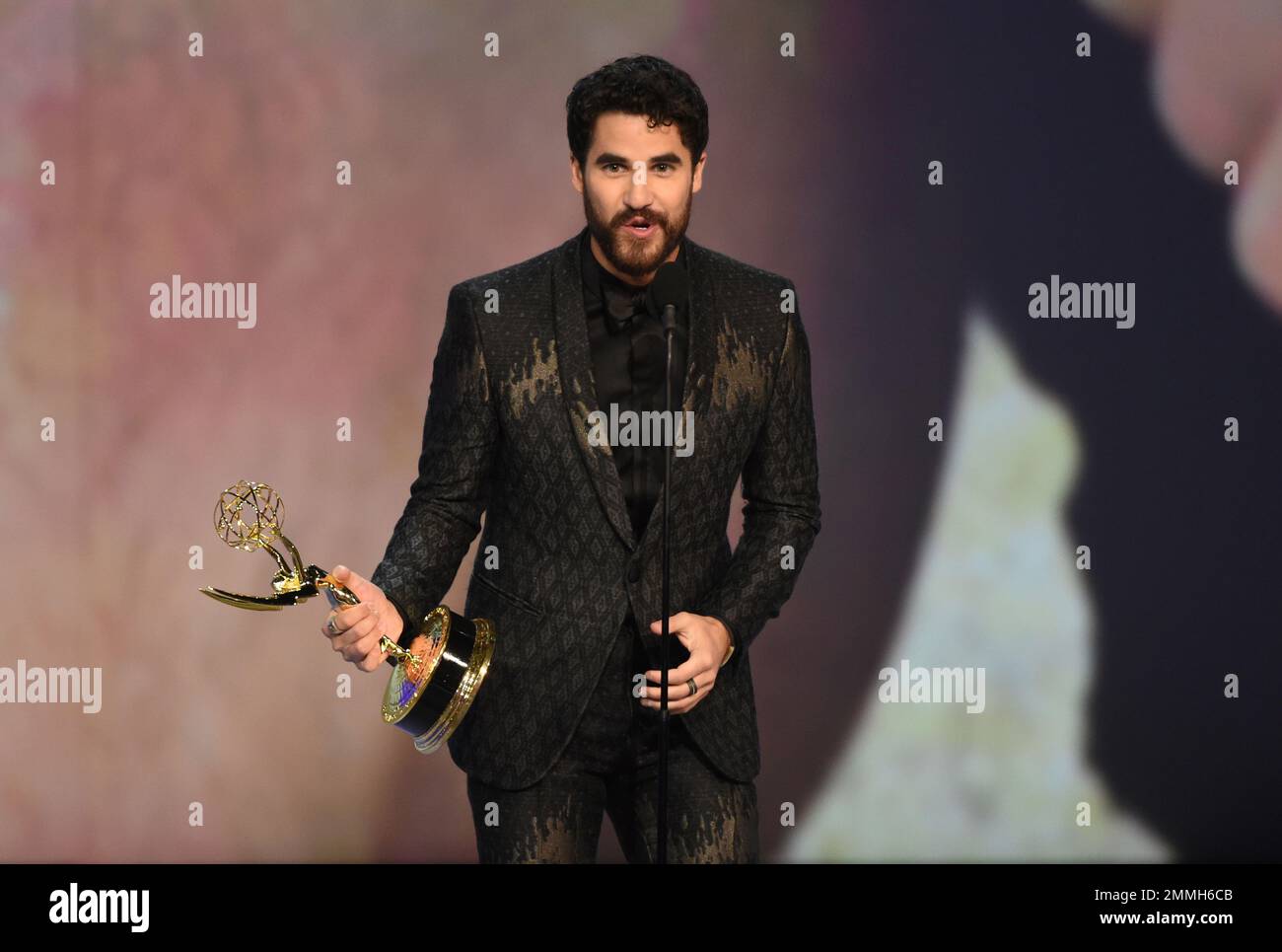Darren Criss accepts the award for outstanding lead actor in a limited