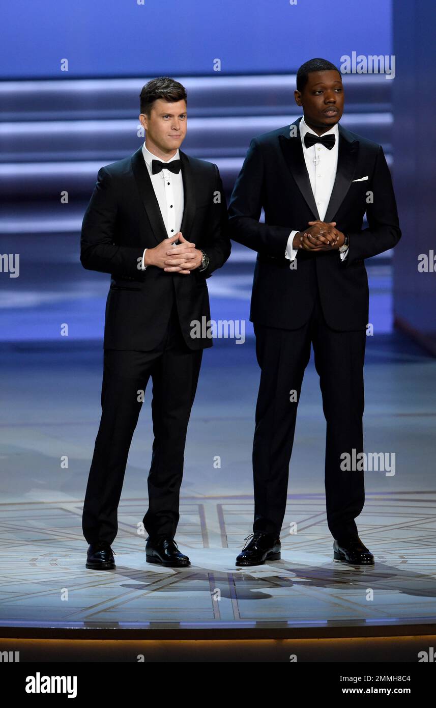 Hosts Colin Jost, left, and Michael Che speak at the 70th Primetime