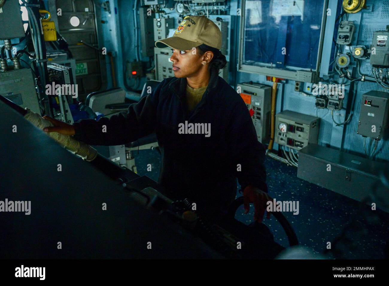 U.S. Navy Seaman Ashley Lemon, drives the Arleigh Burke-class guided ...