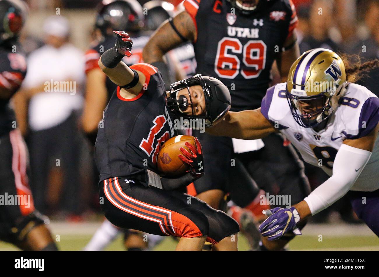 Washington linebacker Benning Potoa'e (8) tackles Utah wide receiver ...