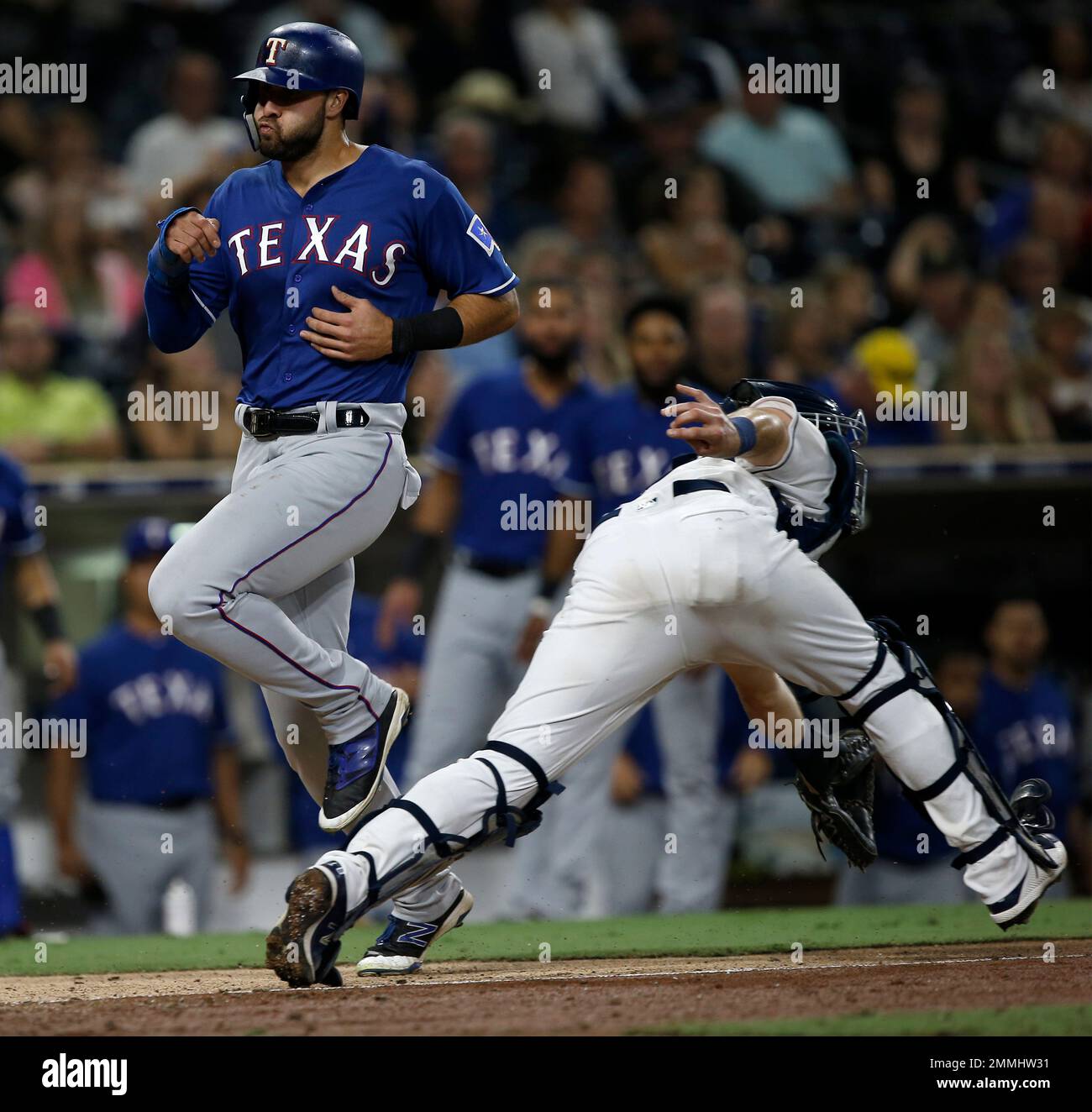 Texas Rangers' Joey Gallo, left, scores as the throw to San Diego ...