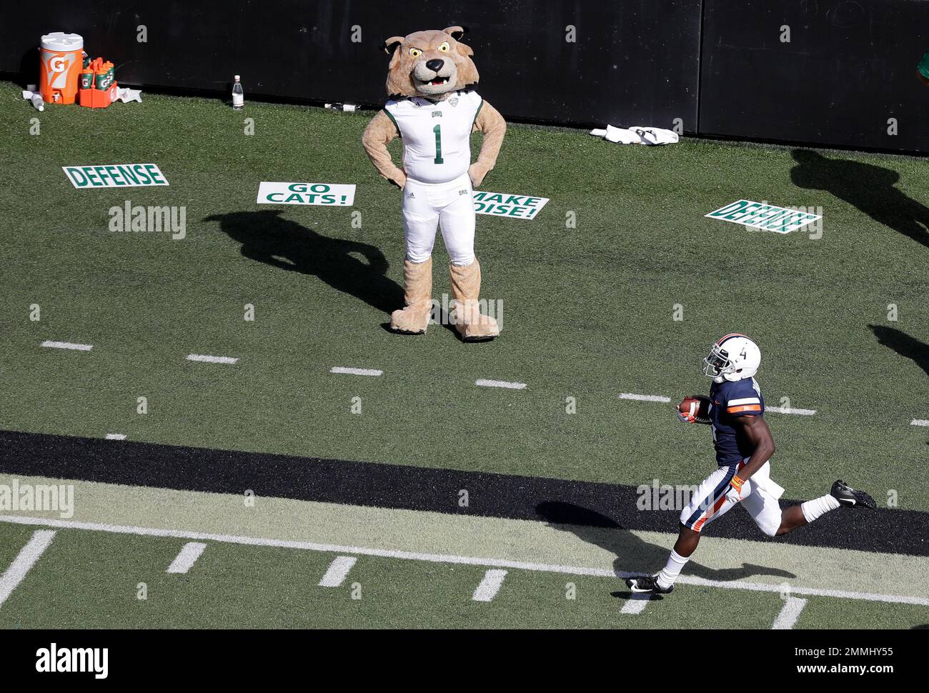 Virginia running back Olamide Zaccheaus passes the Ohio mascot as