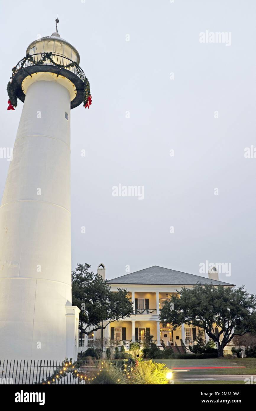 The Biloxi Lighthouse, opened in 1848 is a landmark still standing after Katrina, with the Visitor's Center in the background which opened in 2011. Stock Photo