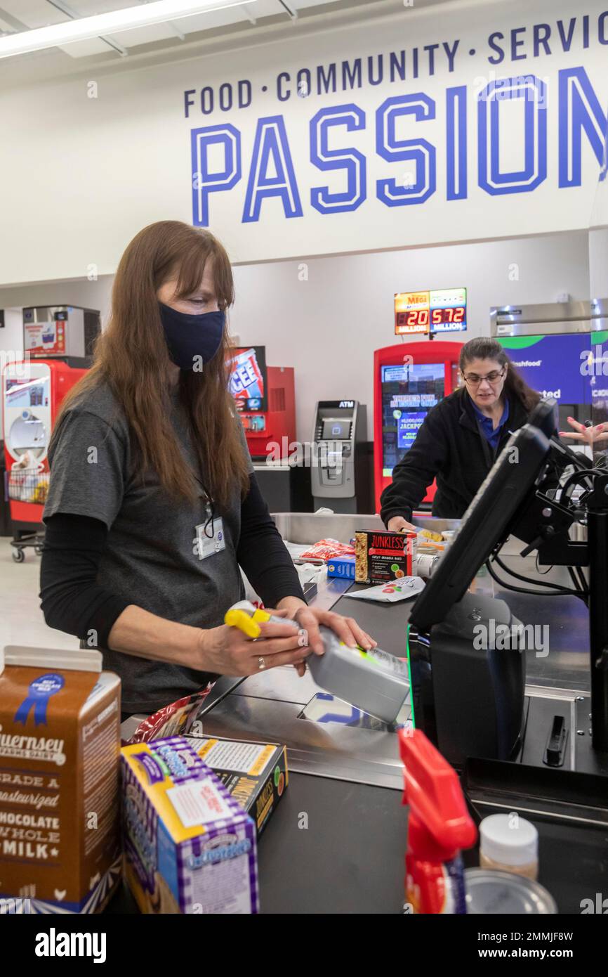 Macomb Twp., Michigan - A workers scans groceries at a Meijer Grocery store, newly opened in suburban Detroit. The store's grocery-only concept is new Stock Photo