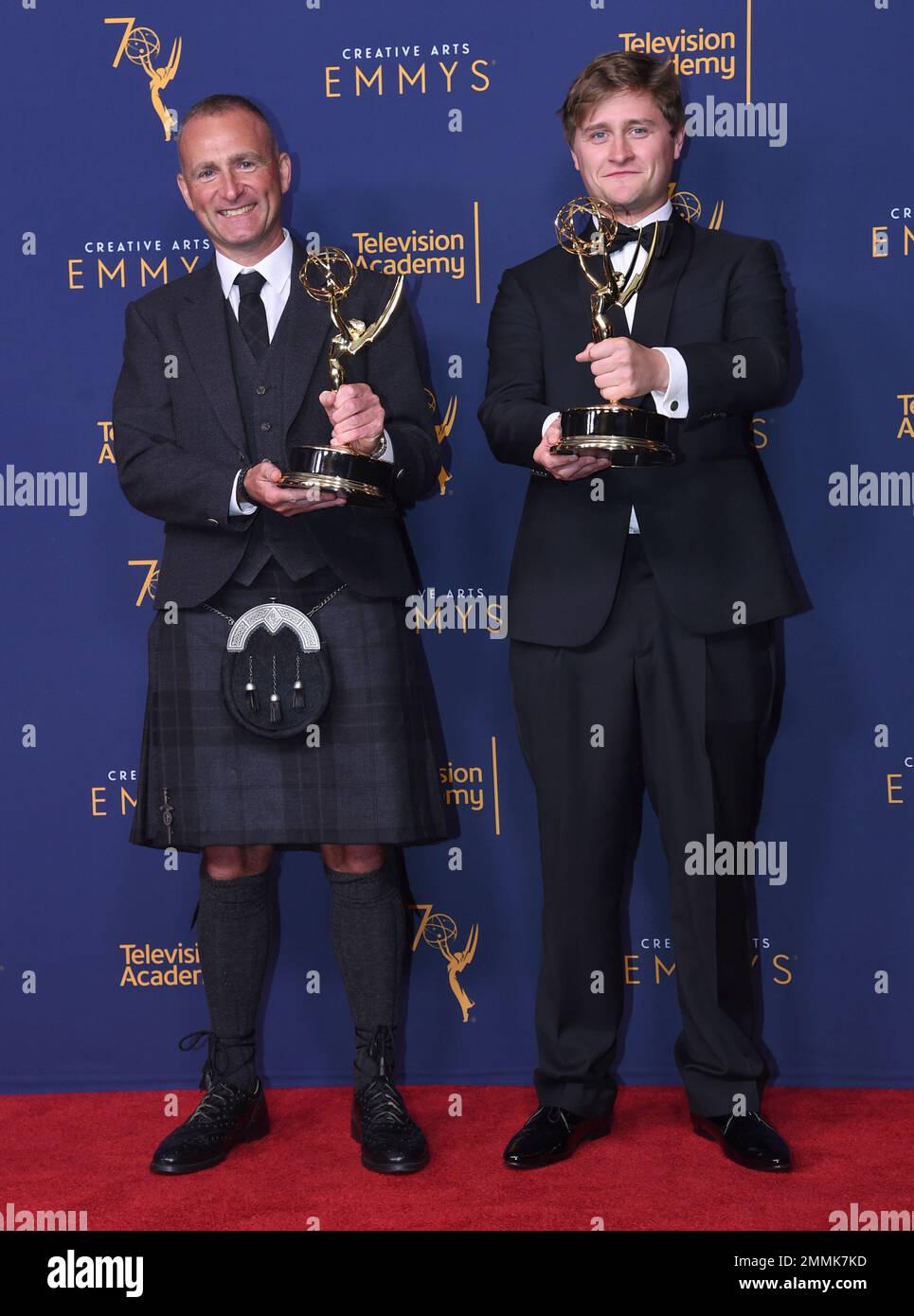 Kenny Clark, left, and Oliver Ferris, winners of the award for outstanding  sound editing for a limited series, movie or special for the "USS  Callister" episode of "Black Mirror", pose in the