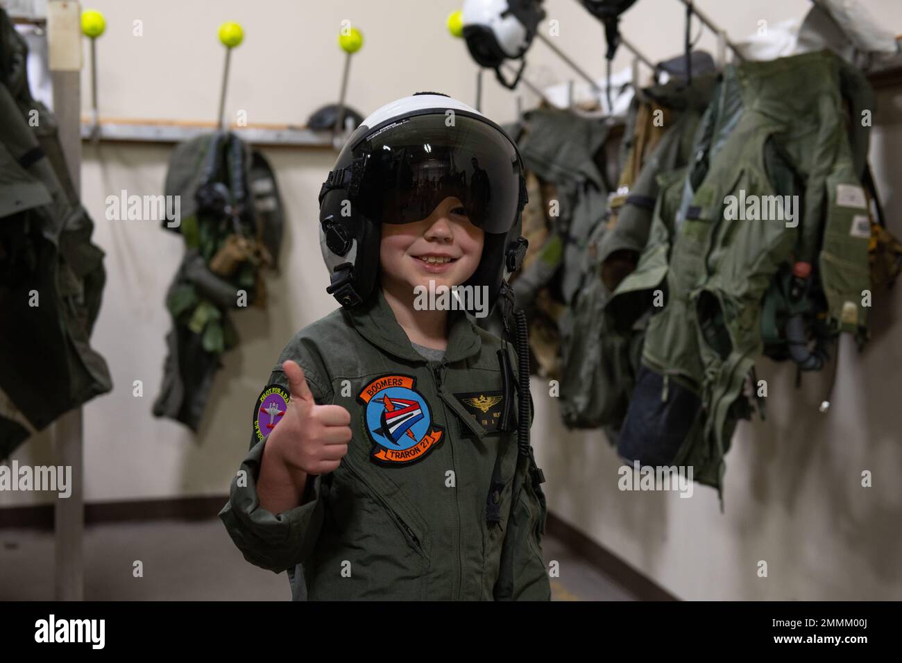 Seth Wilkey, Pilot for a Day, wears a Naval Aviator helmet in the VT-28 Paraloft on Naval Air Station Corpus Christi, Sept. 20. Pilot for a Day is a public outreach program between Training Squadron 35 and Driscoll Children's Hospital where children experience a day in the life of a Naval Aviator. Stock Photo