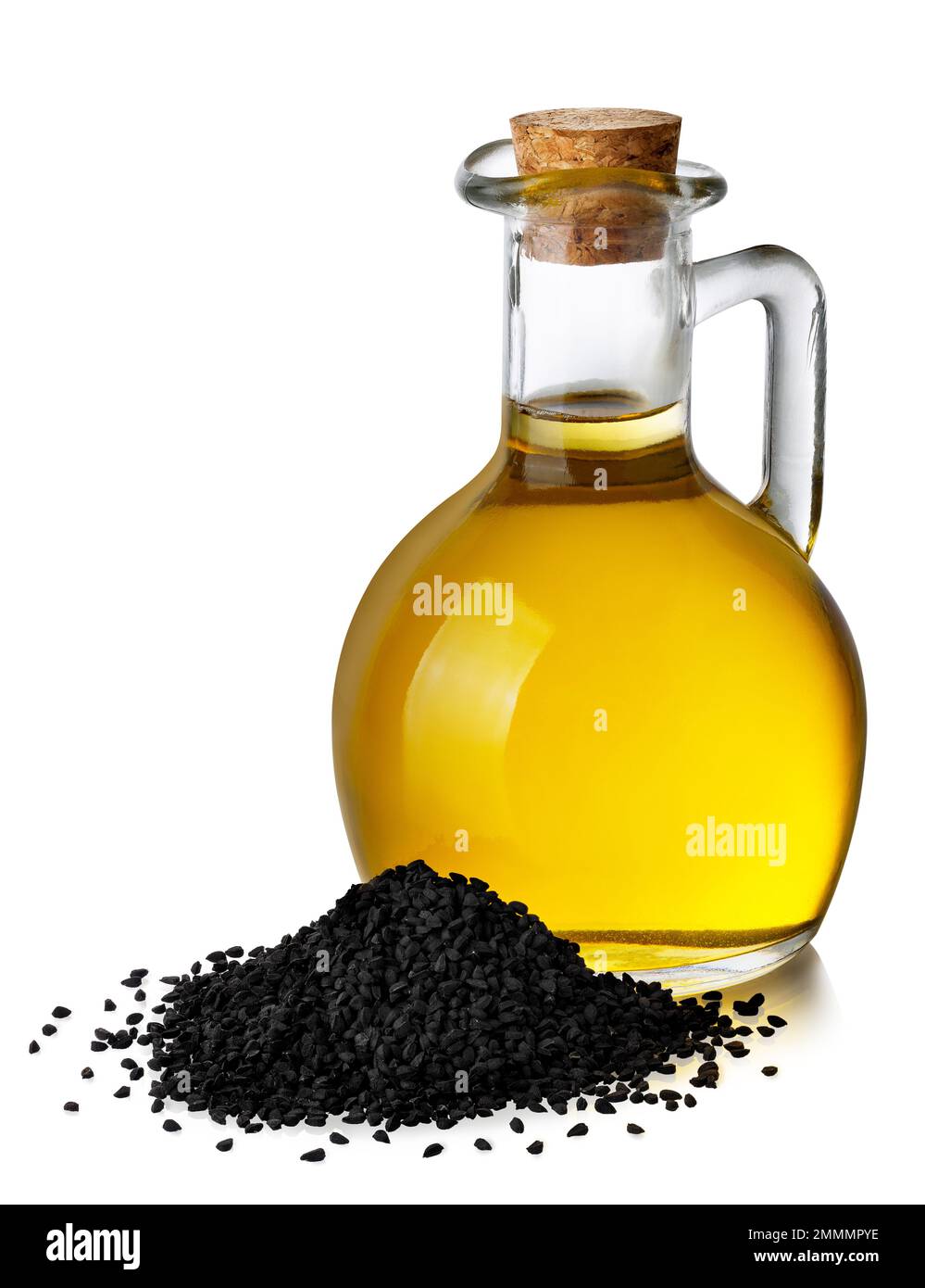 black cumin oil in glass bottle and heap of seeds isolated on white