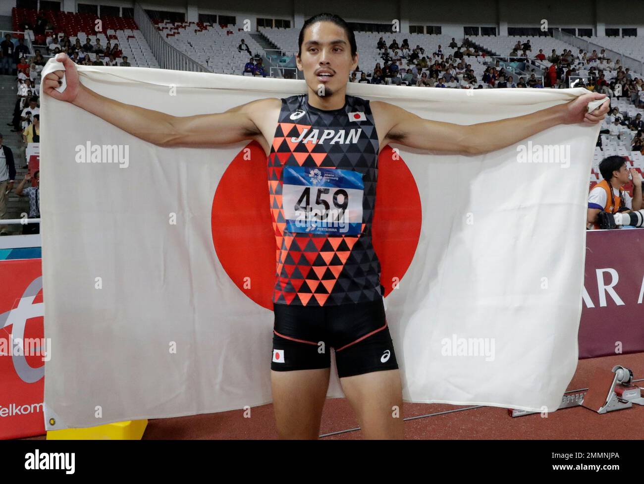 Japan's Takatoshi Abe celebrates after his third place finish in the