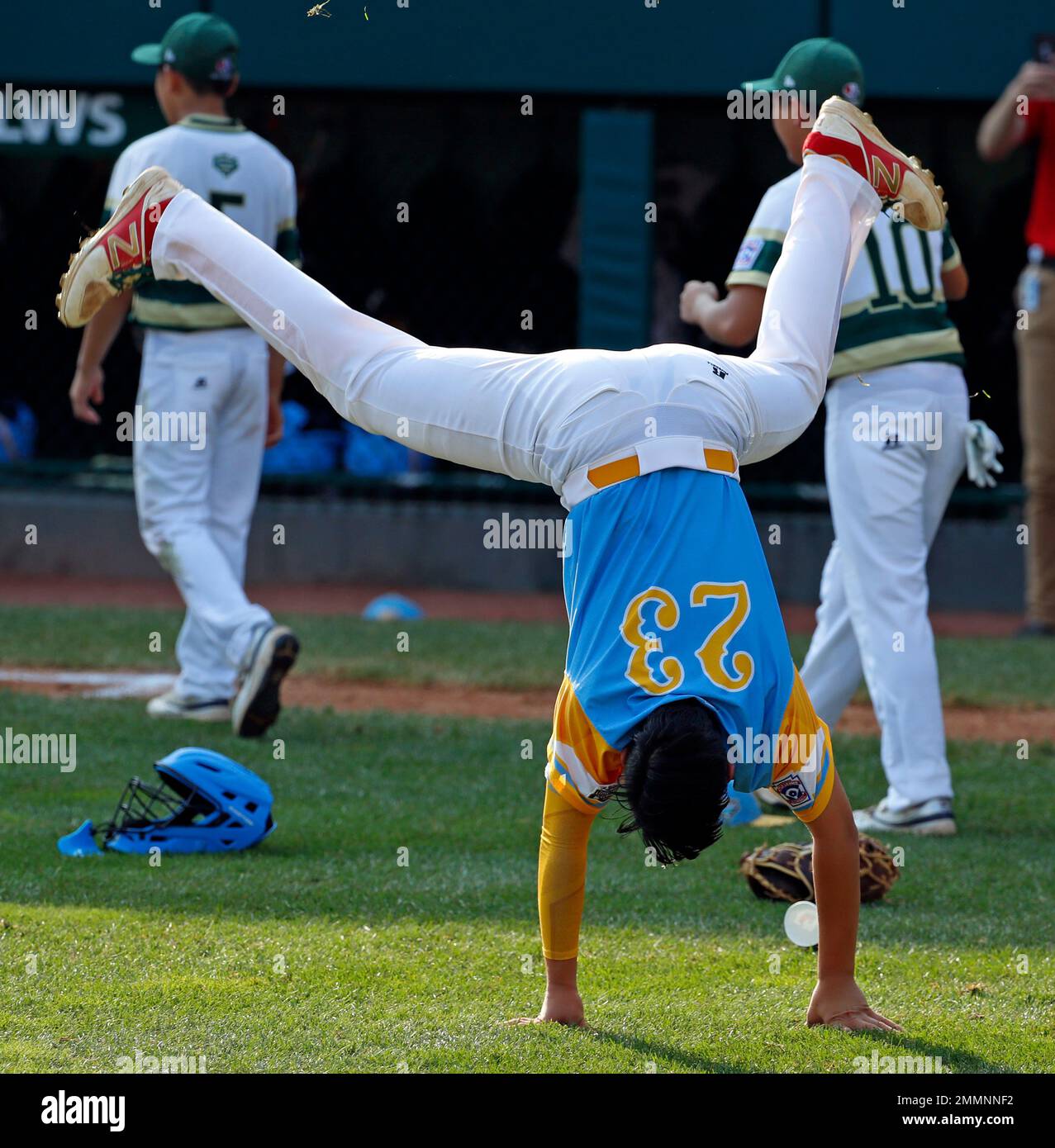 Honolulu, Hawaii's Aukai Kea (23) does a cartwheel while celebrating