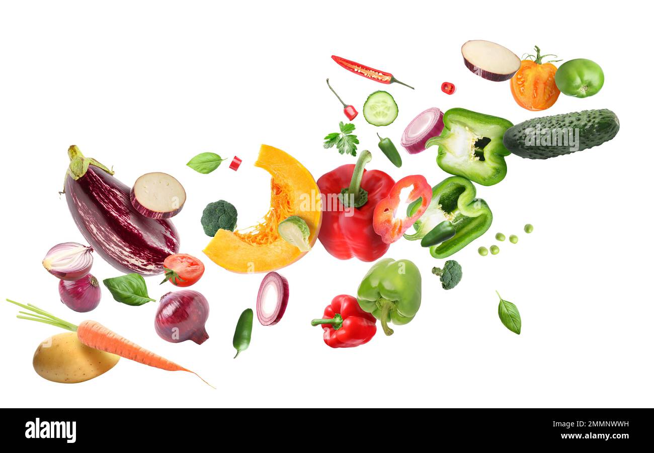Flying ripe vegetables on white background Stock Photo