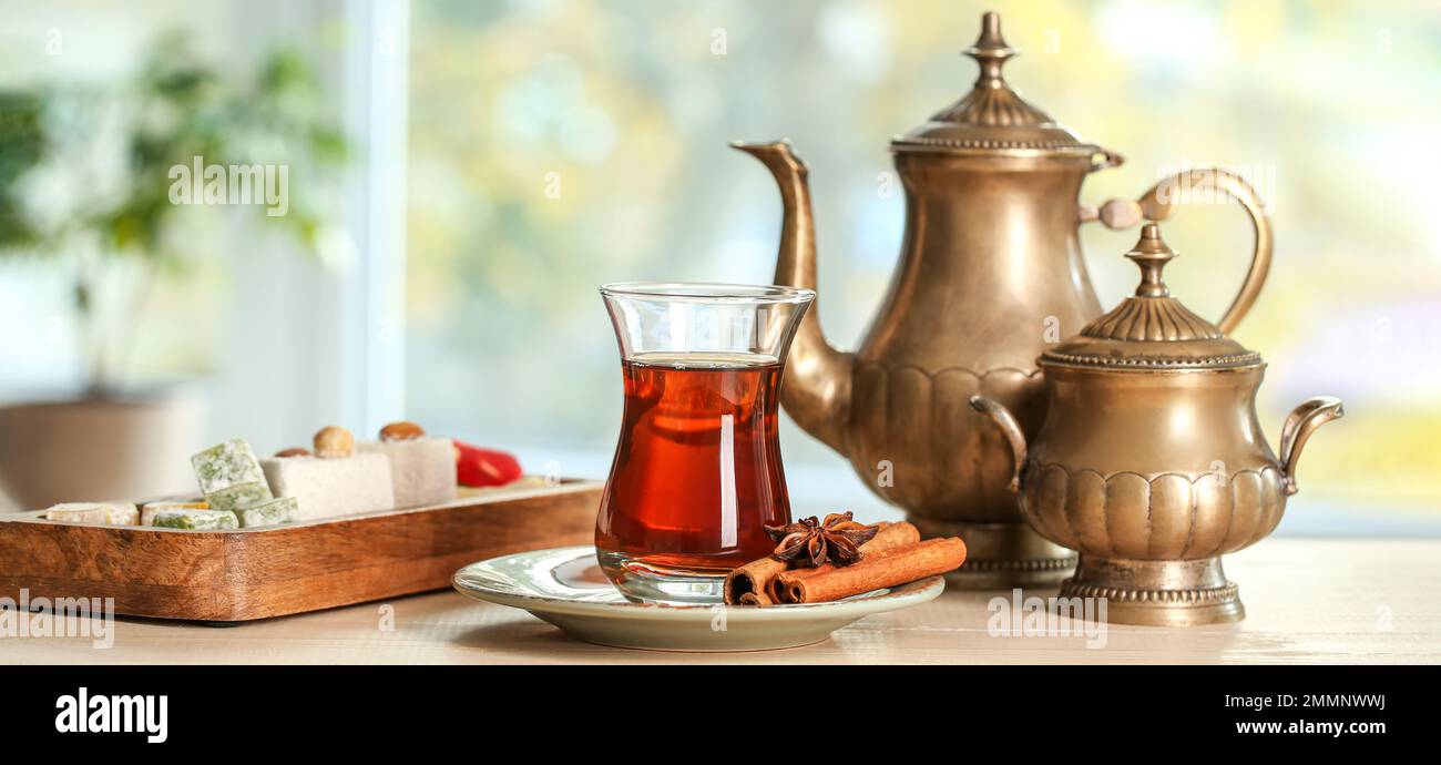 https://c8.alamy.com/comp/2MMNWWJ/cup-of-turkish-tea-spices-sweets-teapot-and-sugar-bowl-on-table-in-room-2MMNWWJ.jpg