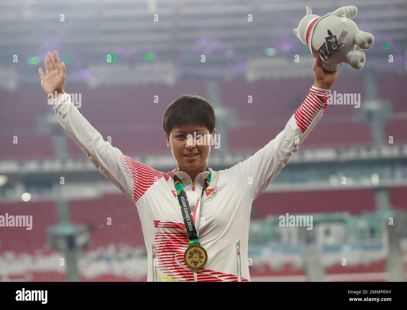 Women's hammer throw gold medalist China's Luo Na stands on the podium