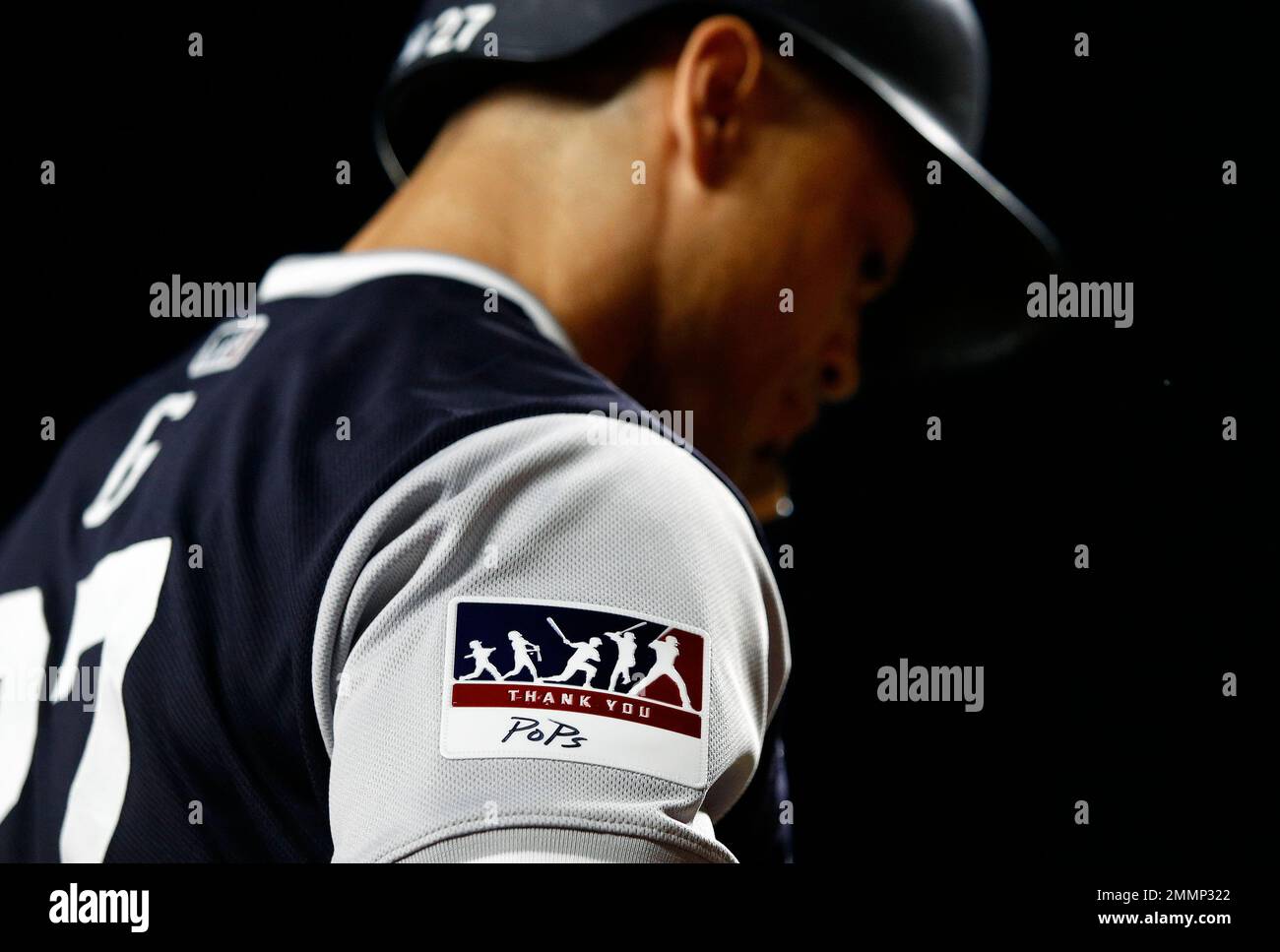 New York Yankees' Giancarlo Stanton wears a commemorative patch on