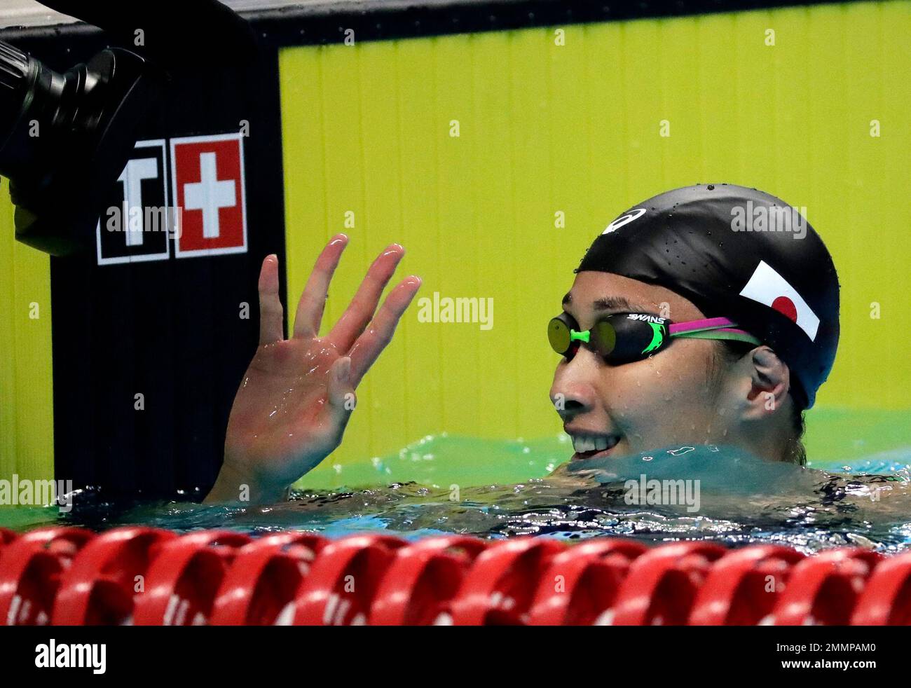 Japans Satomi Suzuki Waves After Winning The Womens 50m Breaststroke