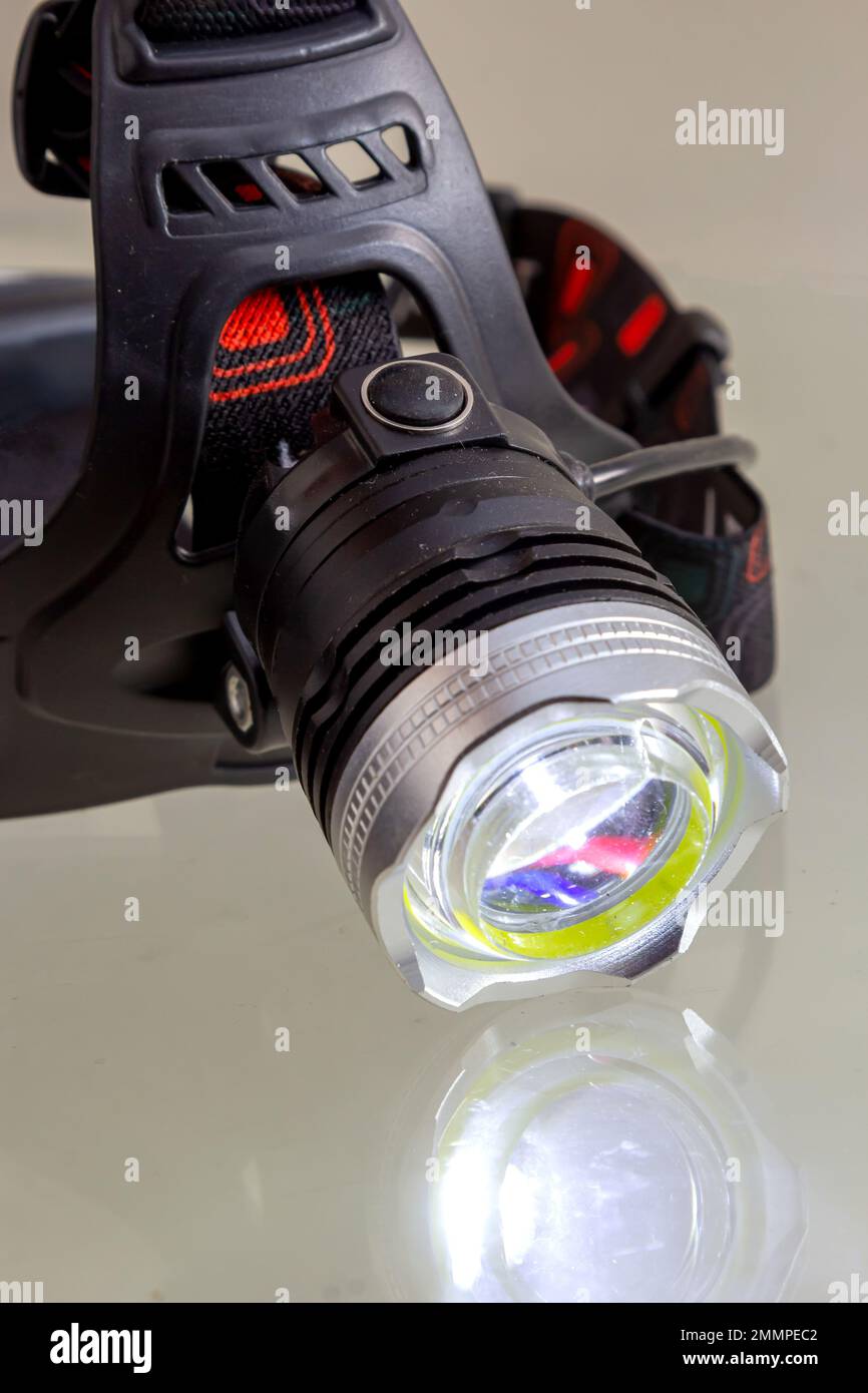 Premium Photo  A head torch light lamp on the person, exploration