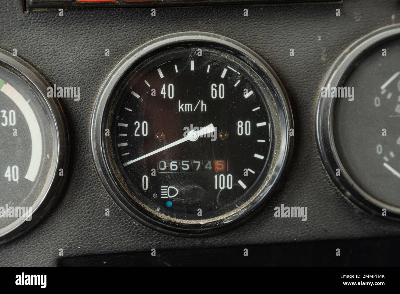 Old car speedometer. Speed indicator background. Parked car zero speed