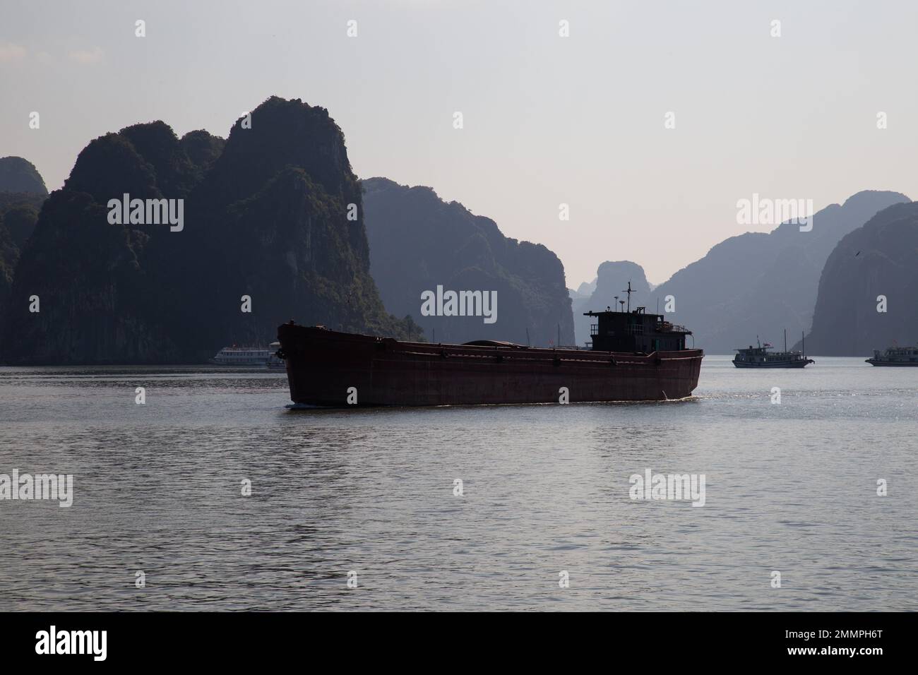 Ha Long Bay ( Halong bay ) View Over Landscape - boats float through the impressive landscape . Ha Long Bay , Vietnam Stock Photo