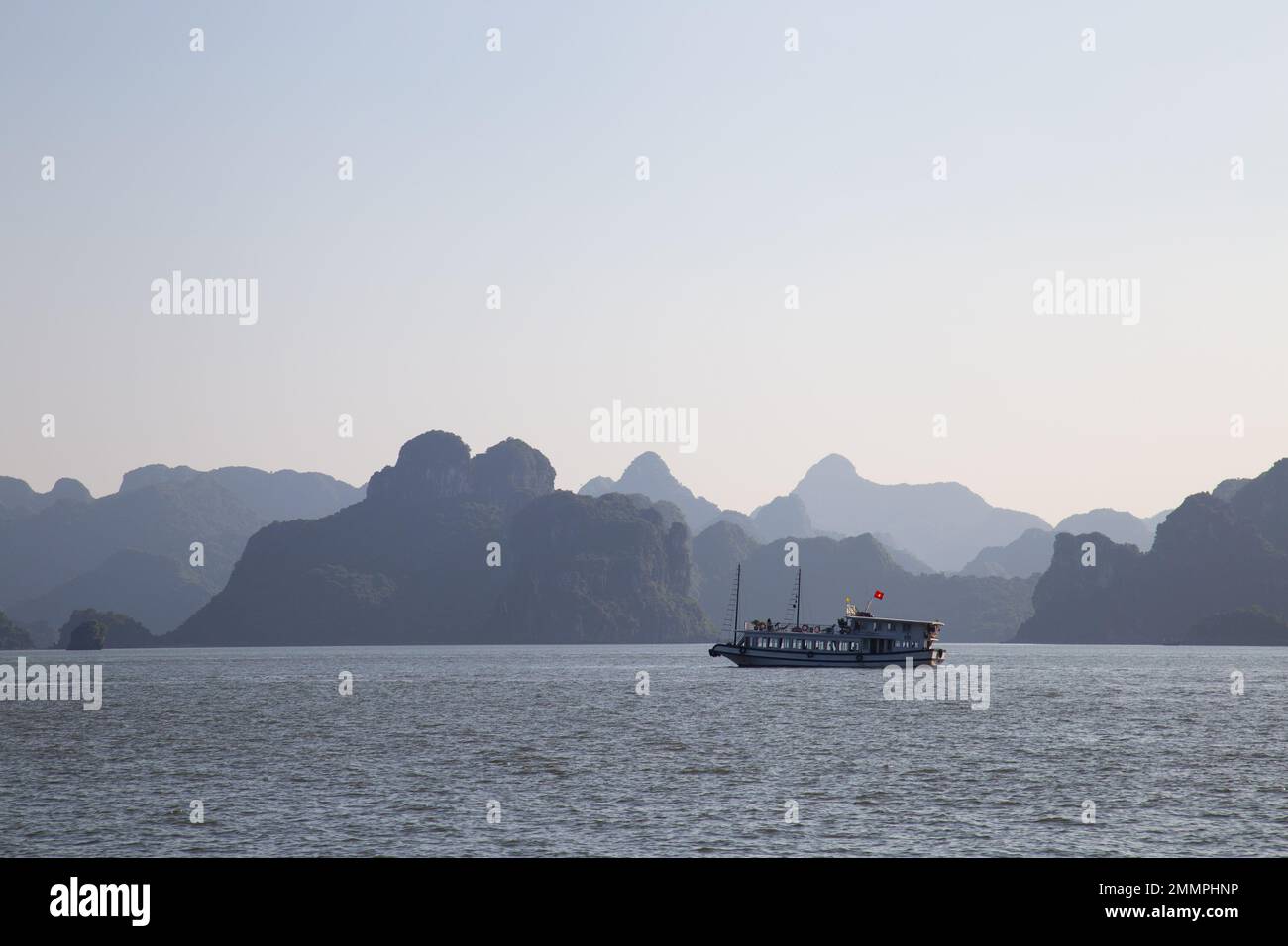 Ha Long Bay ( Halong bay ) View Over Landscape - boats float through the impressive landscape . Ha Long Bay , Vietnam Stock Photo