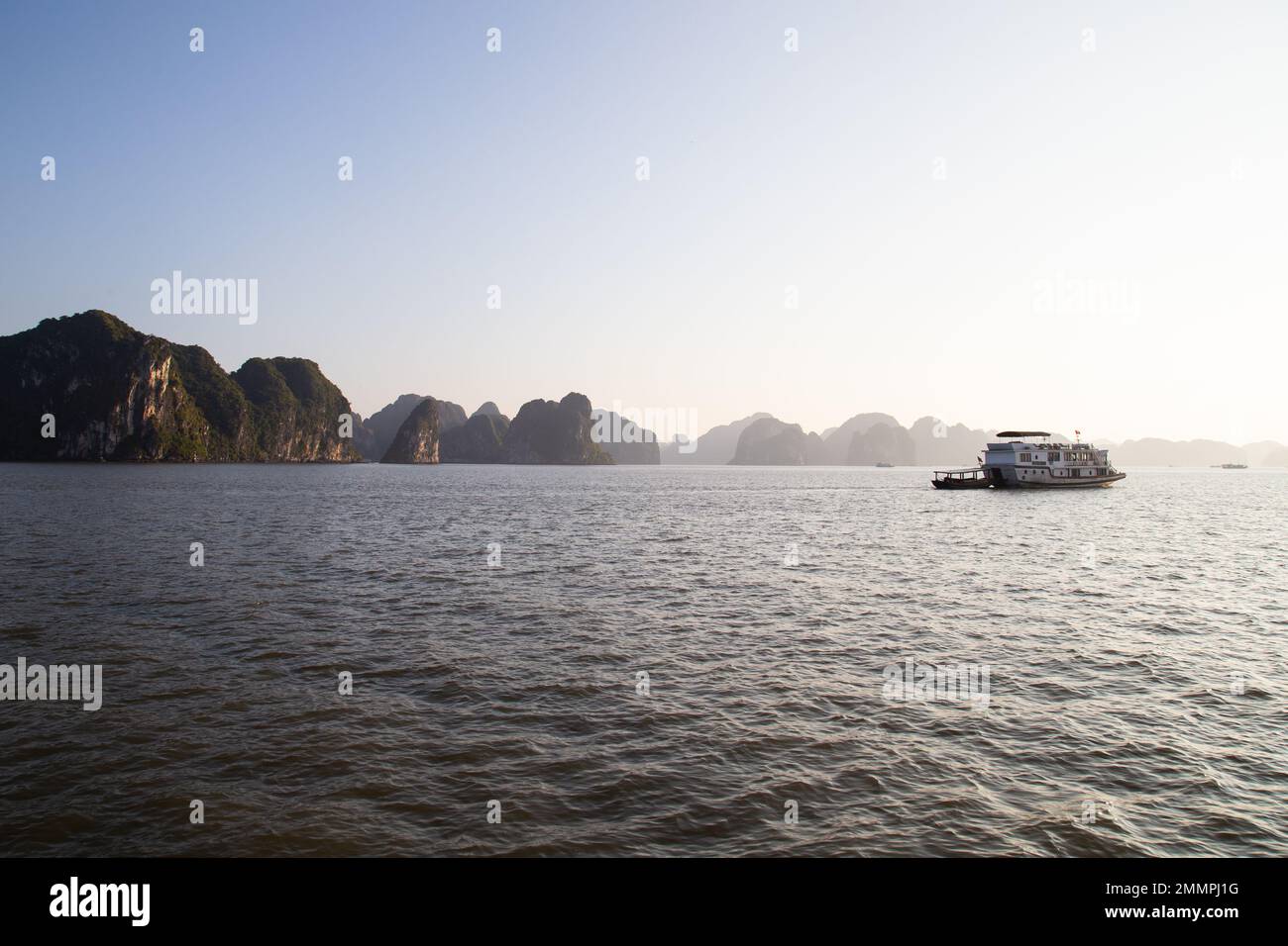 Ha Long Bay ( Halong bay ) View Over Landscape - boats float through the impressive landscape . Ha Long Bay , Vietnam Stock Photo