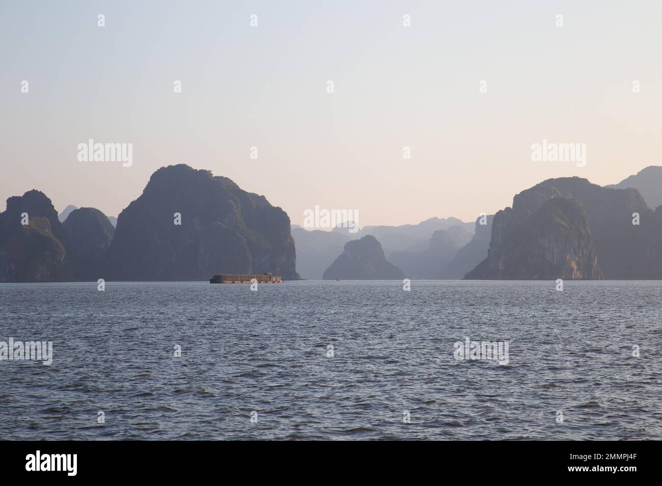 Ha Long Bay ( Halong bay ) View Over Landscape - boats float through the impressive landscape . Ha Long Bay , Vietnam Stock Photo