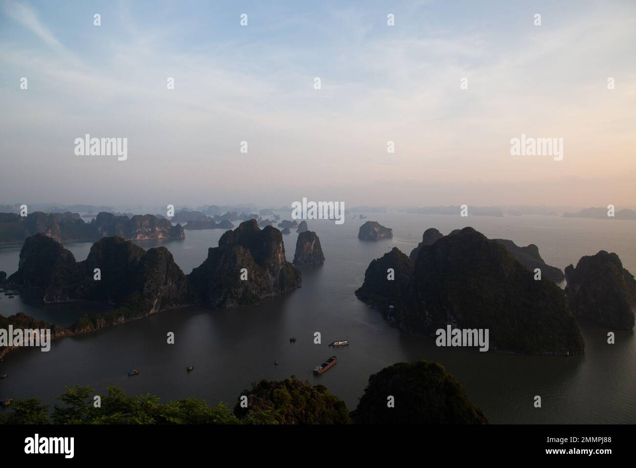 Ha Long Bay ( Halong bay ) View Over Landscape - boats float through the impressive landscape . Ha Long Bay , Vietnam Stock Photo