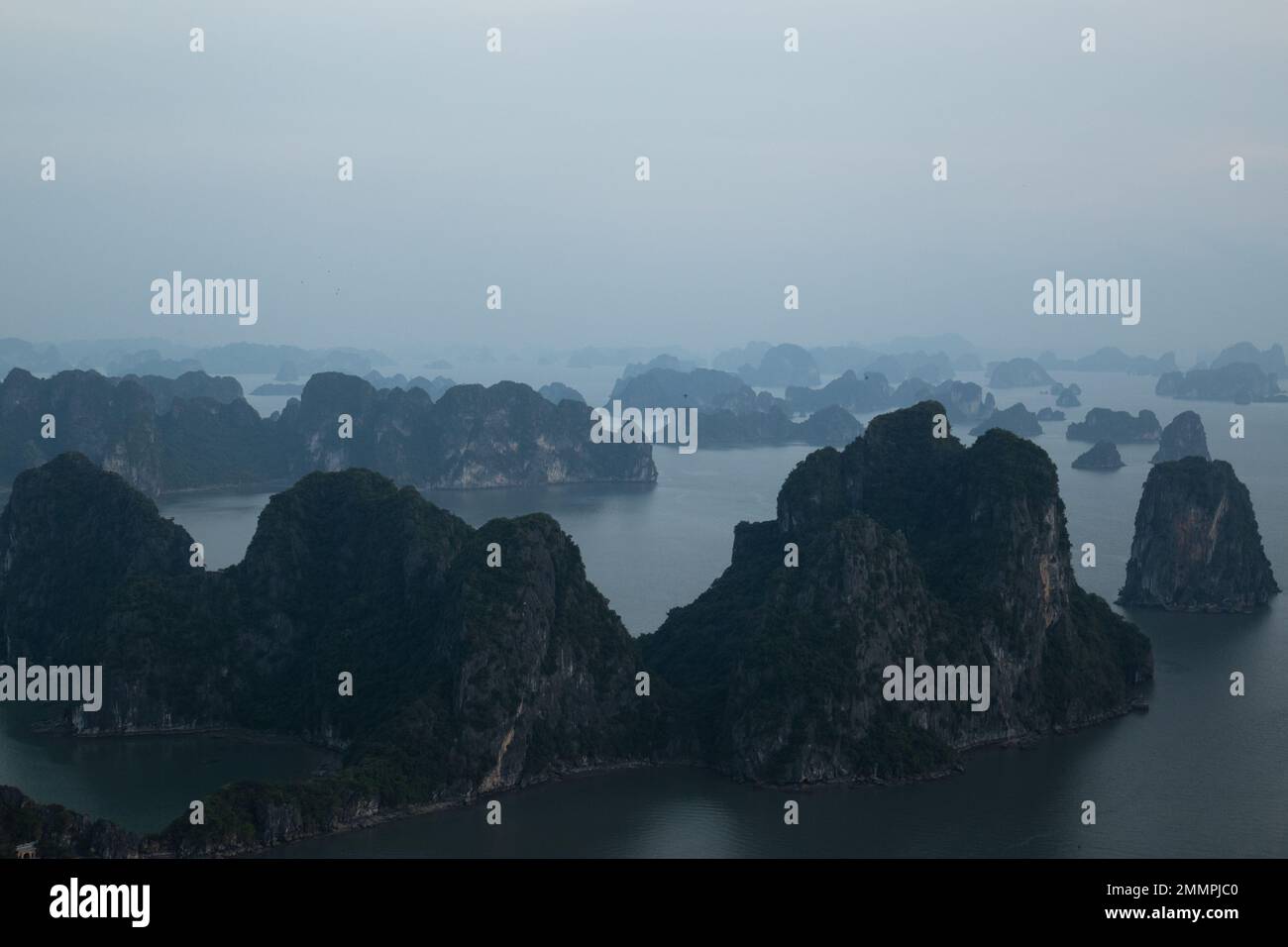 Ha Long Bay ( Halong bay ) View Over Landscape - boats float through the impressive landscape . Ha Long Bay , Vietnam Stock Photo