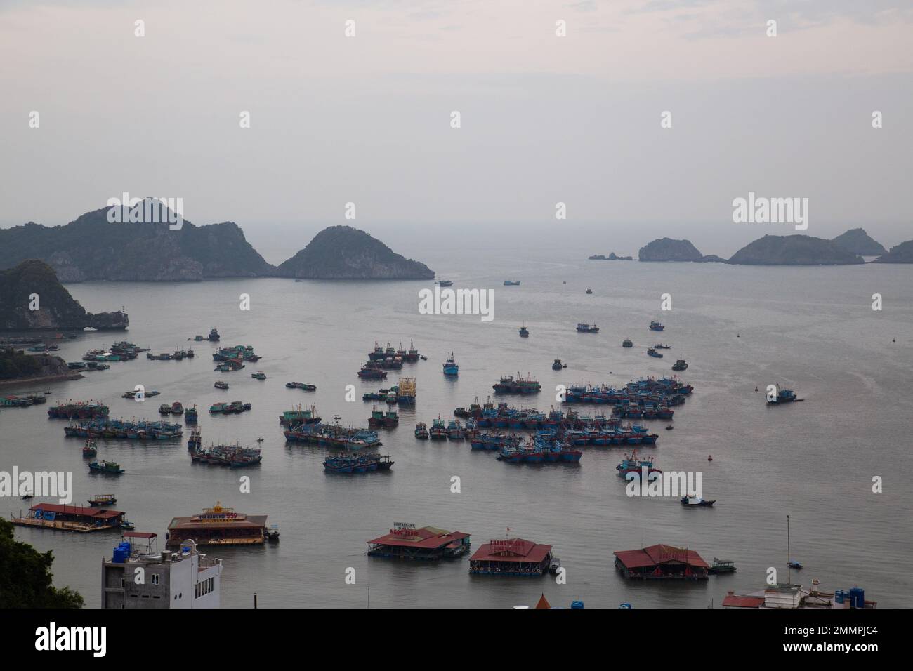 Ha Long Bay ( Halong bay ) View Over Landscape - boats float through the impressive landscape . Ha Long Bay , Vietnam Stock Photo