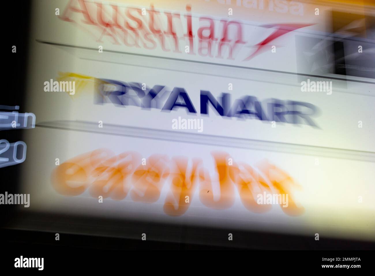 Cologne, Germany. 30th Jan, 2023. On a display panel at Cologne/Bonn Airport, the company logo of the airline Ryanair can be seen between the logos of Austrian and easyjet. The airline Ryanair announces the figures for the past 3rd quarter on Monday, 30.01.2023. Credit: Thomas Banneyer/dpa/Alamy Live News Stock Photo