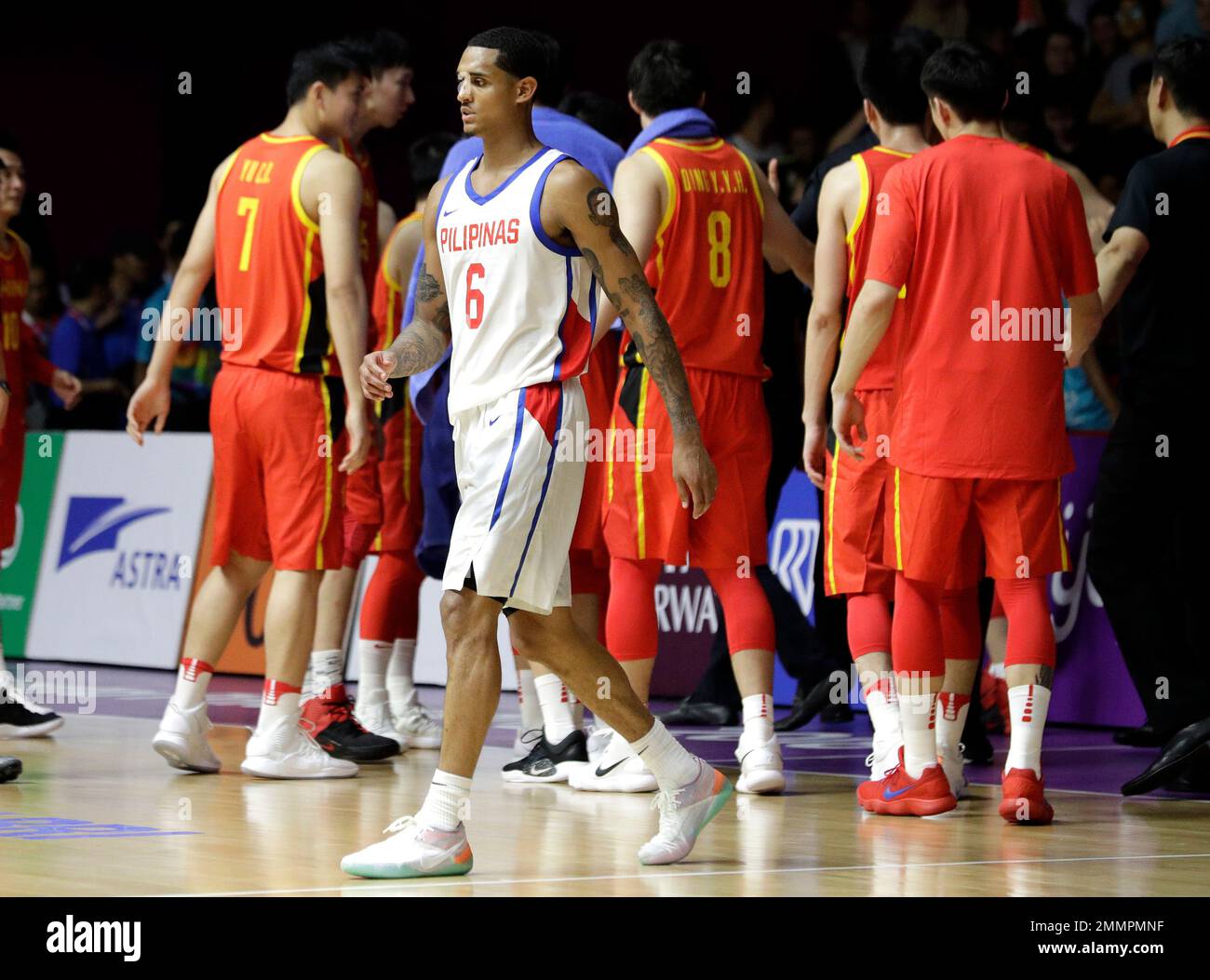 Philippines' Jordan Clarkson leaves the court following his teams 82-80  loss to China in their men's basketball game at the 18th Asian Games in  Jakarta, Indonesia on Tuesday, Aug. 21, 2018. (AP