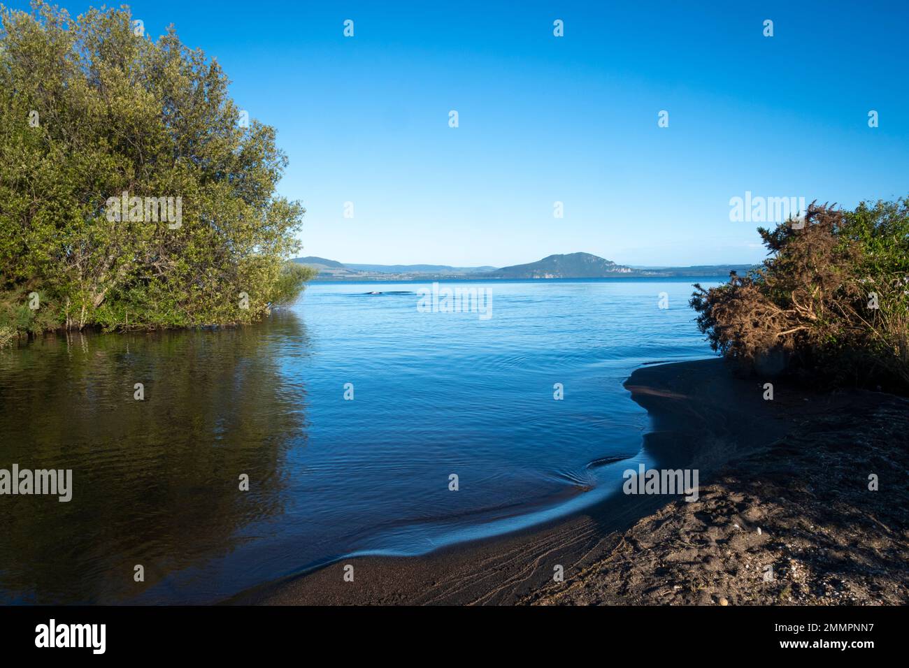 Calm inlet on Lake Taupo, Waiotaka Scenic Reserve, North Island, New Zealand Stock Photo