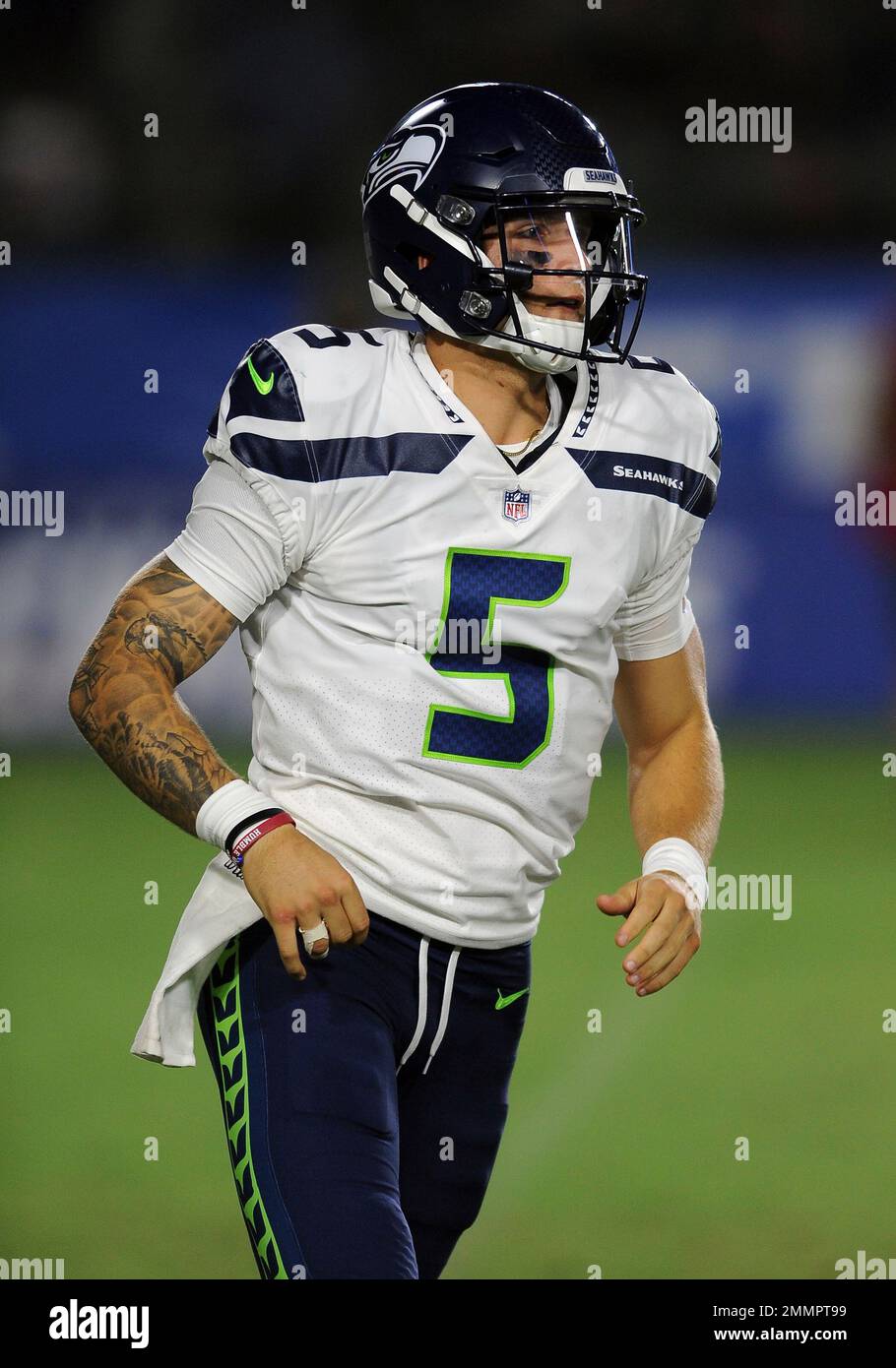 Seattle Seahawks quarterback Alex McGough (5) looks down field