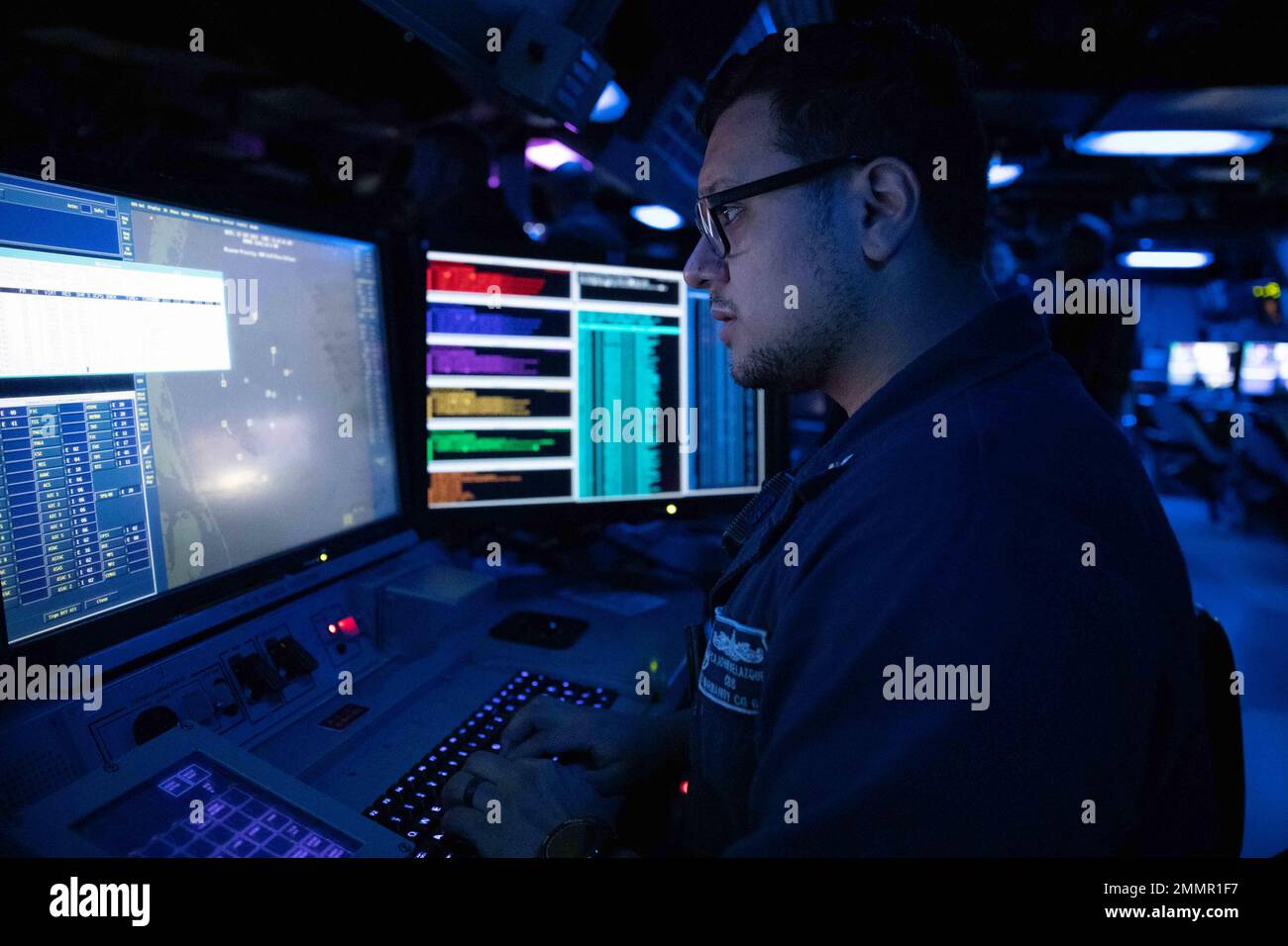 220922-N-LK647-0031 ATLANTIC OCEAN (Sept. 22, 2022) Fire Controlman (AEGIS) 2nd Class John Velazquez monitors the integrity of the computer systems aboard the Ticonderoga-class guided-missile cruiser USS Normandy (CG 60) following the ship’s completion of Surface Warfare Advanced Tactical Training (SWATT). Normandy is underway as part of the Gerald R. Ford Carrier Strike Group conducting SWATT exercises to increase lethality, ensure combat readiness, and promote tactical innovation. SWATT is led by the Naval Surface and Mine Warfighting Development Center, whose mission is to increase the tact Stock Photo