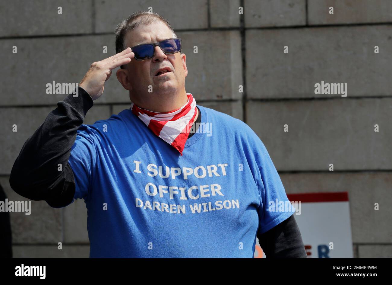 A man standing with members of Patriot Prayer and other groups